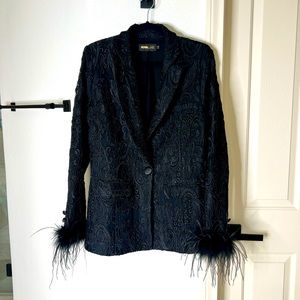 Beautiful lace suit with feather detailing